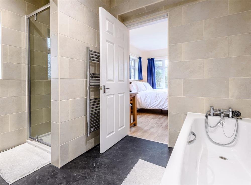 Family bathroom with bath and separate shower enclosure at White Oak Cottage in Hagworthingham, near Horncastle, Lincolnshire