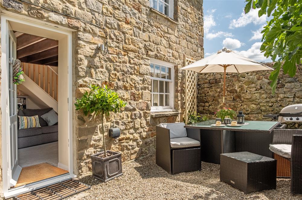 Front entrance with patio seating area at White Rose Cottage, Constable Burton, Leyburn