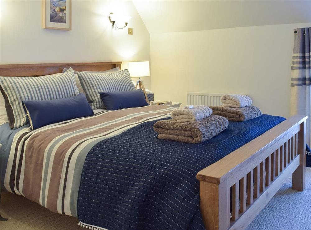 Comfortable and romantic double bedroom at White Stones Cottage in Caister-on-Sea, near Great Yarmouth, Norfolk