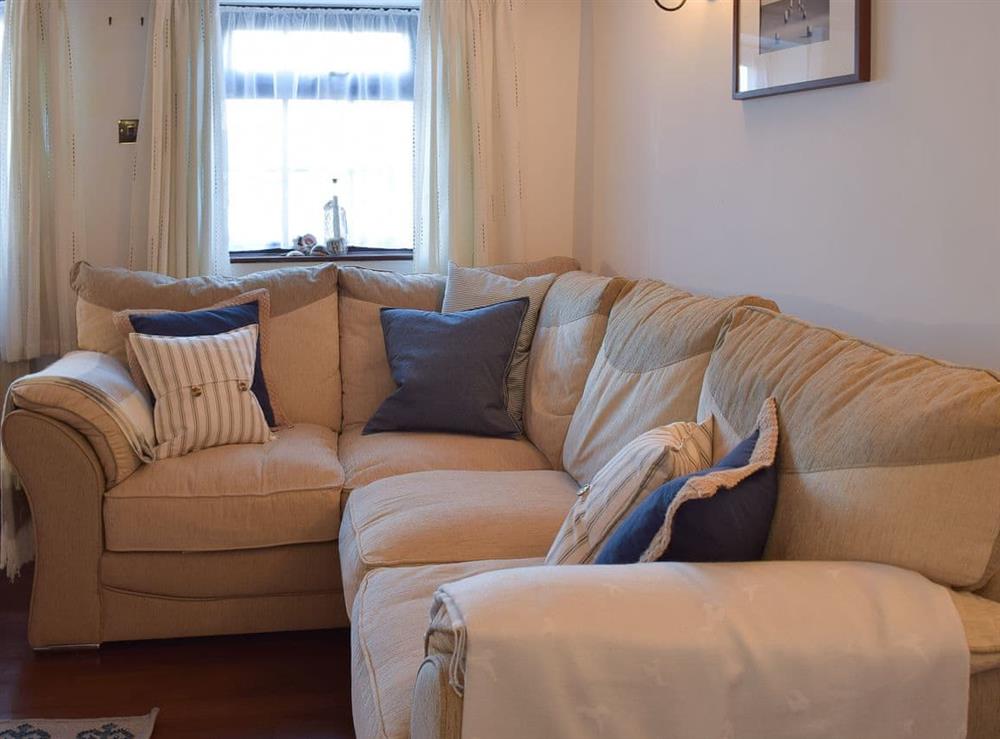 Comfortable and welcoming living room at White Stones Cottage in Caister-on-Sea, near Great Yarmouth, Norfolk