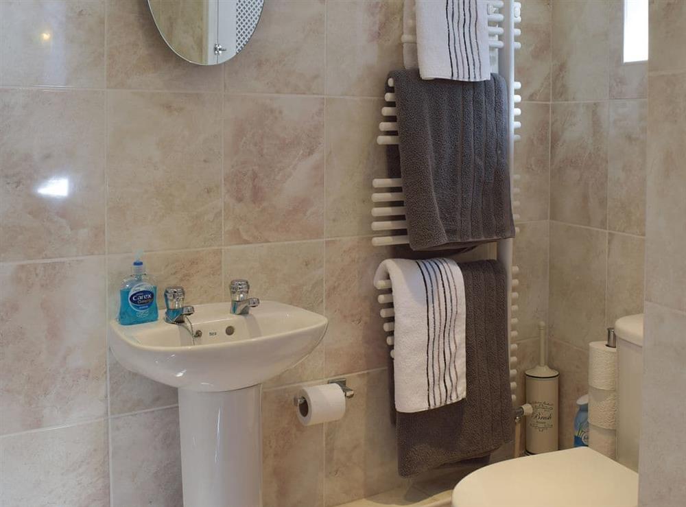 Shower room with heated towel rail at White Stones Cottage in Caister-on-Sea, near Great Yarmouth, Norfolk
