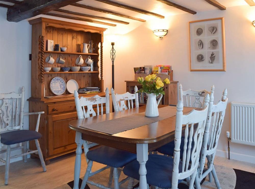 Traditional beamed dining room at White Stones Cottage in Caister-on-Sea, near Great Yarmouth, Norfolk