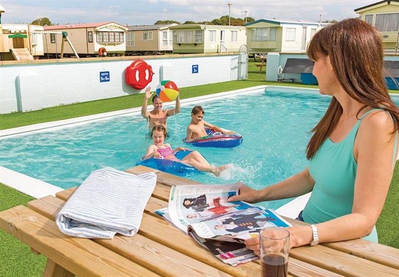 Outdoor heated pool at White Tower Holiday Park in Llandwrog, North Wales & Snowdonia