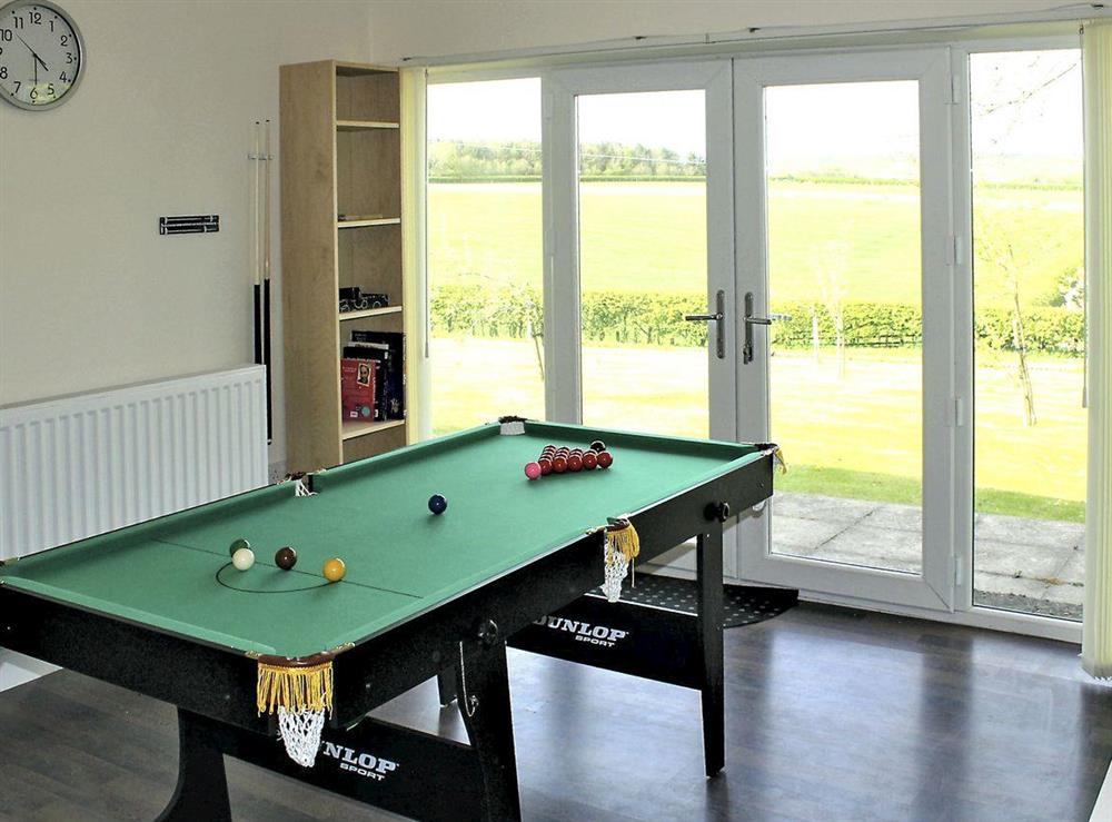 Games room with doors leading to the garden at White View Lodge in Crook, near Bishop Auckland, County Durham, England