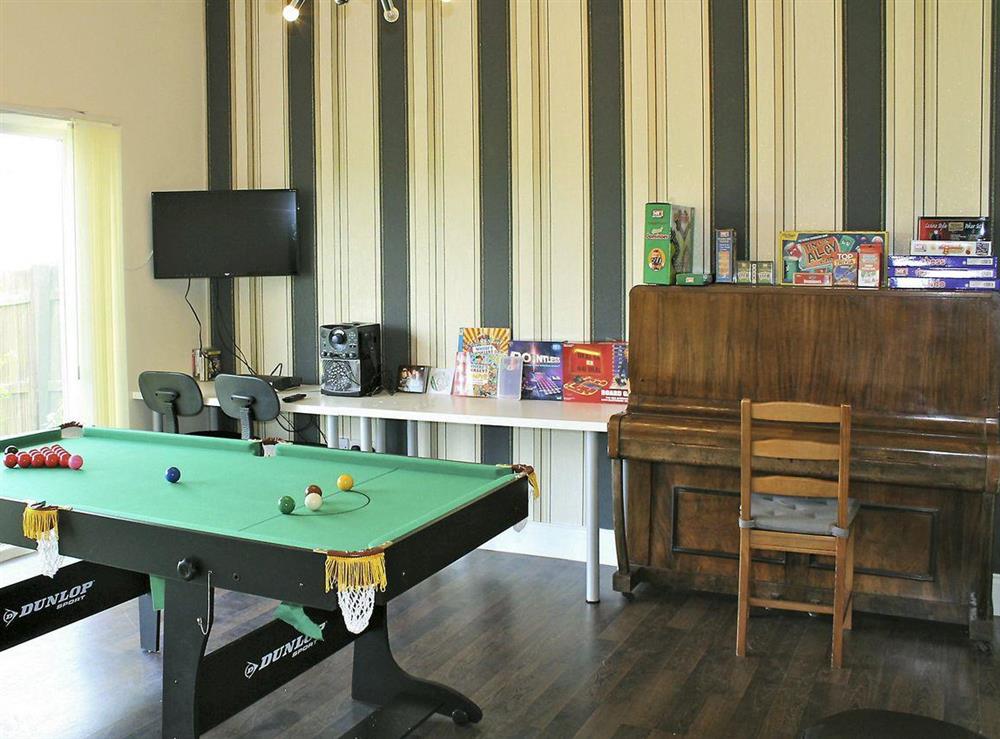 Games room with pool/snooker table, piano, karaoke machine, Freeview TV, DVD player, Playstation, darts board and selection of board games at White View Lodge in Crook, near Bishop Auckland, County Durham, England