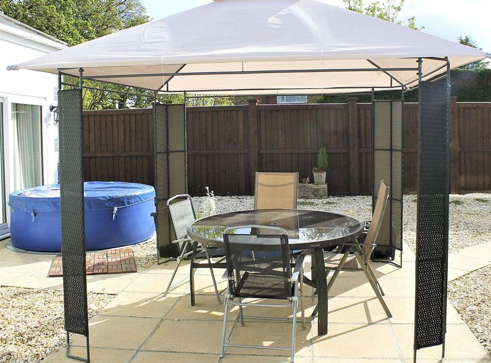 Patio area with gazebo, outdoor eating area and a private hot tub at White View Lodge in Crook, near Bishop Auckland, County Durham, England