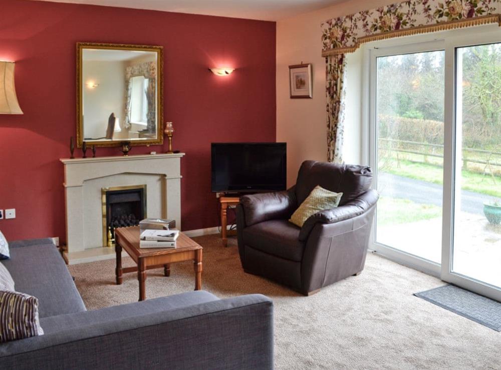 Living room with patio doors at Whitegate View in Forton, near Chard, Somerset