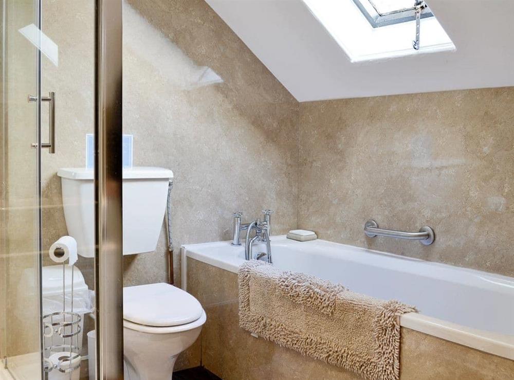 Family bathroom with separate shower cubicle at Whitehall in Mealsgate, Cumbria