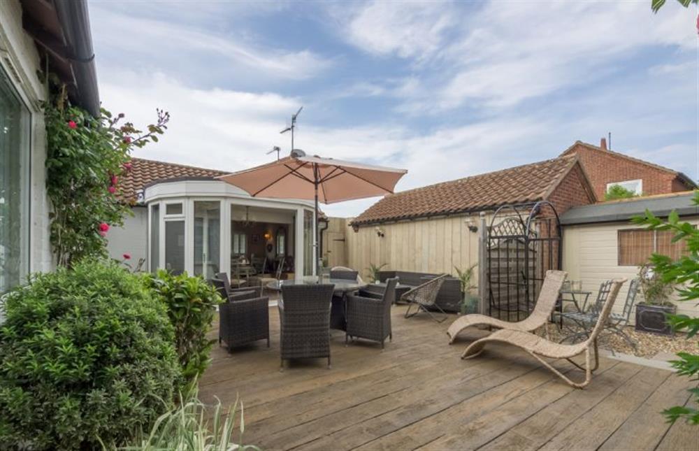 Garden with comfortable seating and barbecue area at Whitehaven, Brancaster near Kings Lynn