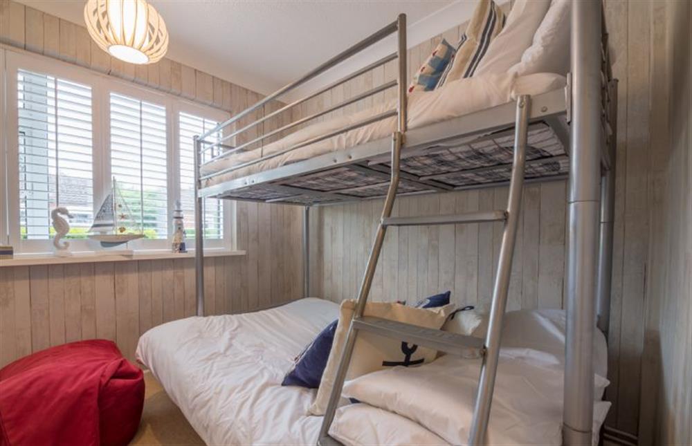 Ground floor: Bedroom three has bunk beds with full-size single on top and small double on the bottom