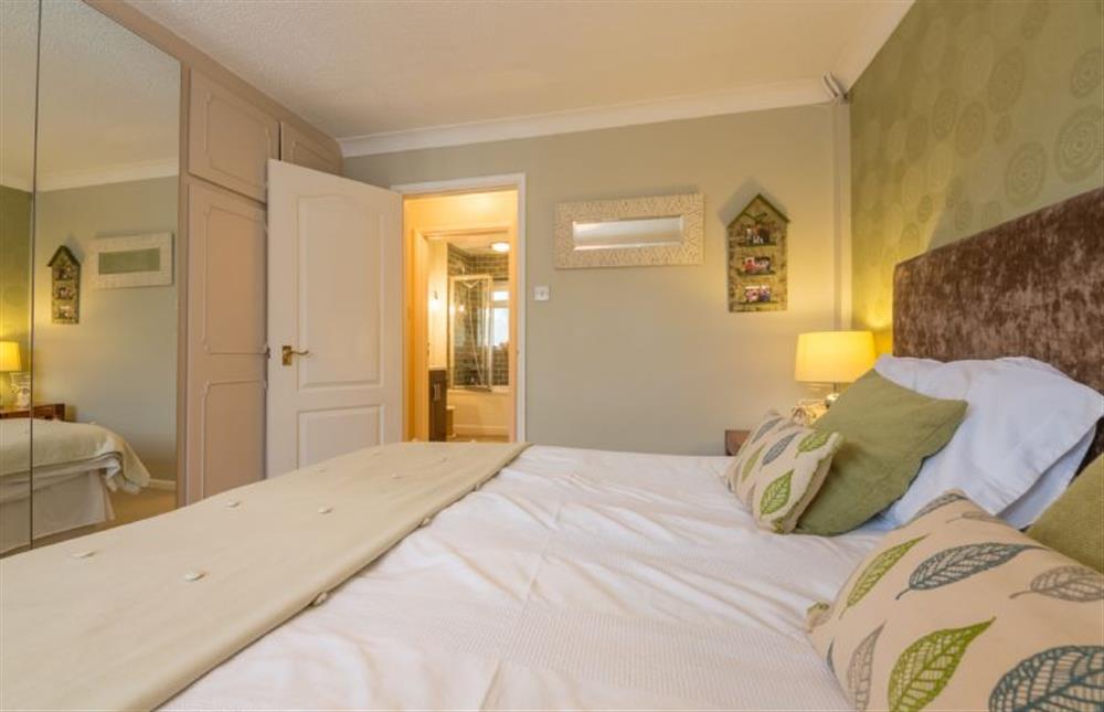 Ground floor: Bedroom two with large mirrored wardrobe at Whitehaven, Brancaster near Kings Lynn