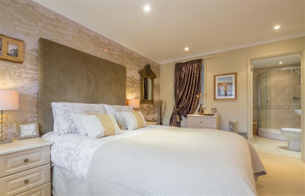 Ground floor: Master bedroom with en-suite shower room at Whitehaven, Brancaster near Kings Lynn