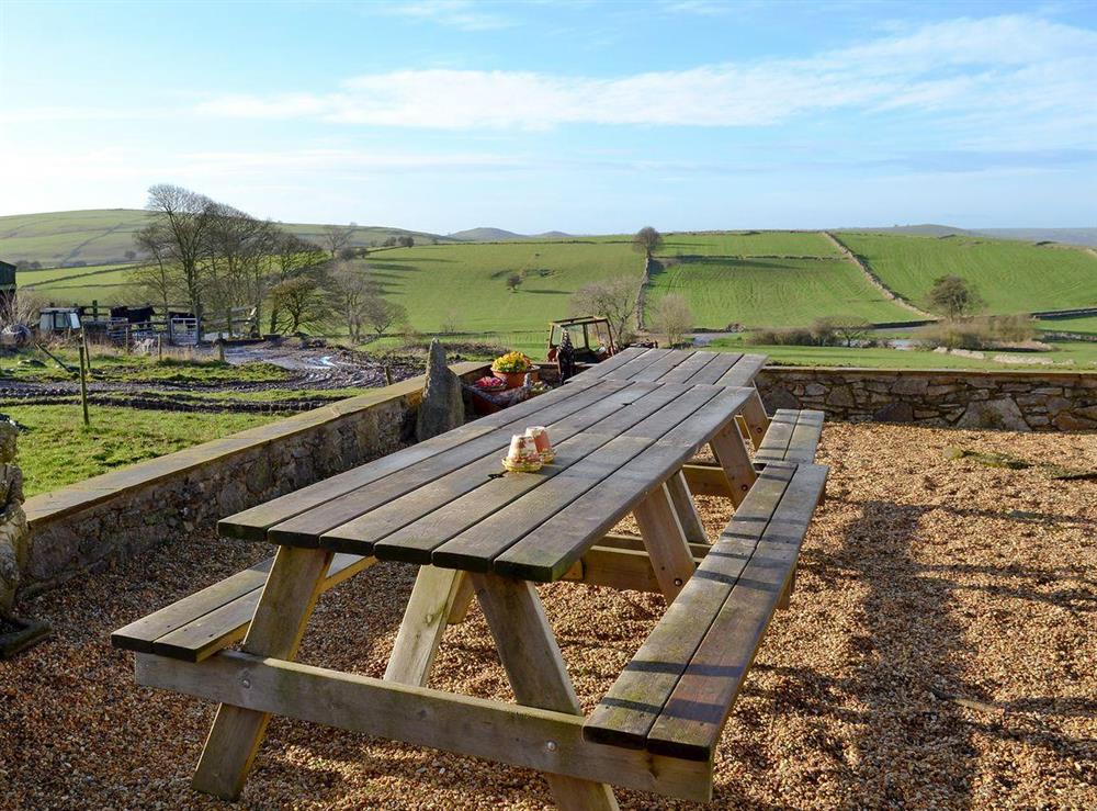 Sitting out area with countryside views at Whitehouse Farm Barn in Heathcote, near Hartington, Derbyshire