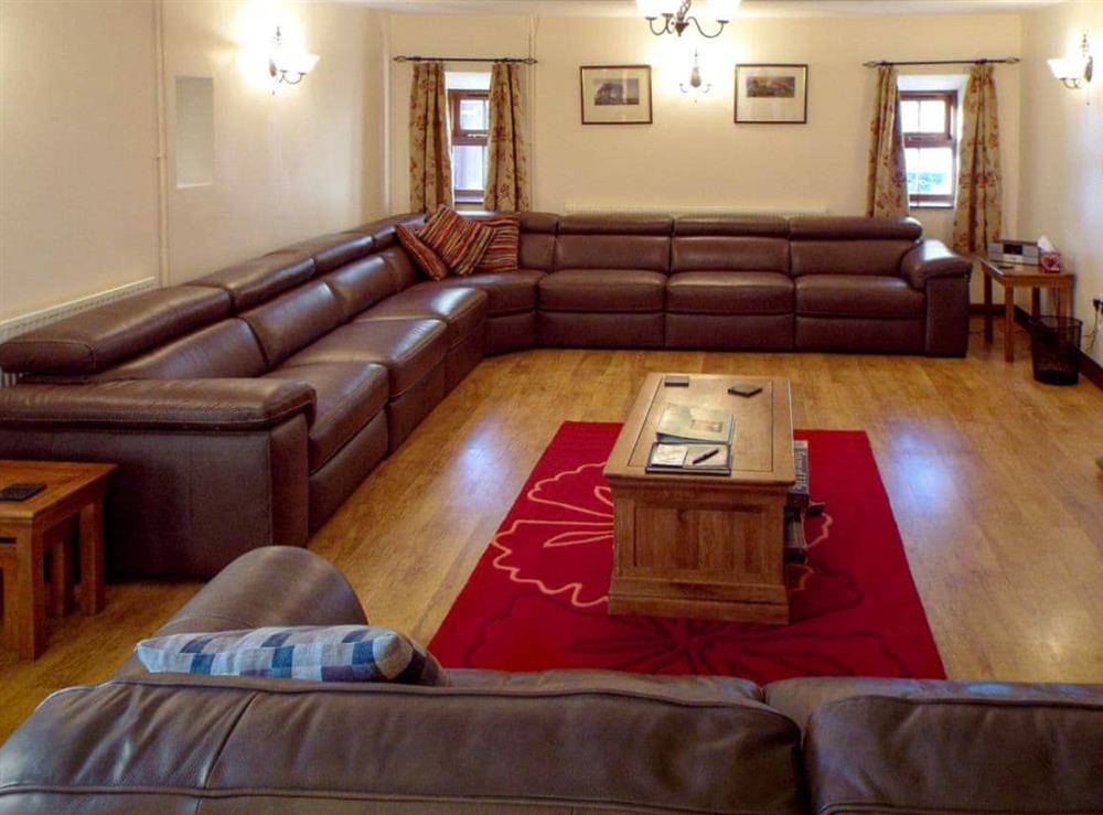 Spacious, comfortable living room at Whitehouse Farm Barn in Heathcote, near Hartington, Derbyshire