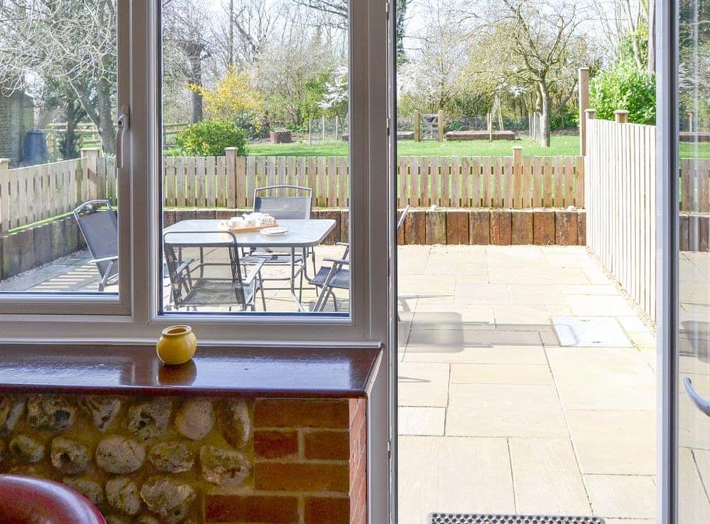 Access from living area to the enclosed paved patio area at The Granary, 