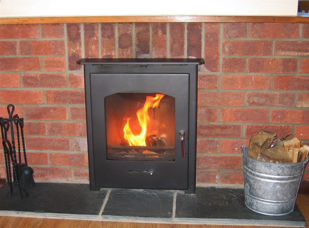 Welcoming living room with cosy wood burner (photo 2) at The Granary, 