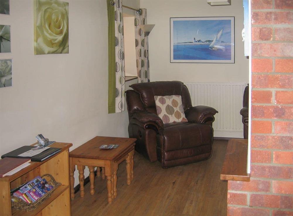 Welcoming living room with cosy wood burner (photo 3) at The Granary, 