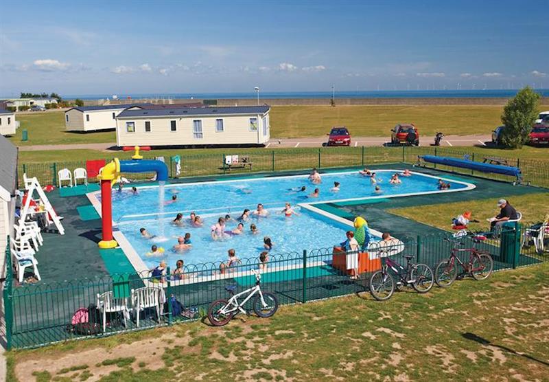 Outdoor heated pool at Whitstable Seaview in , Kent