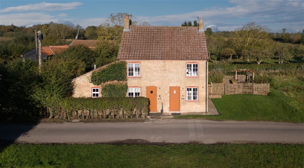 The exterior of semi-detatched holiday cottages. Cladium is on the left and Wicken Rose Cottage is on the right, Cambridgeshire at Wicken Rose Cottage in Ely, Cambridgeshire