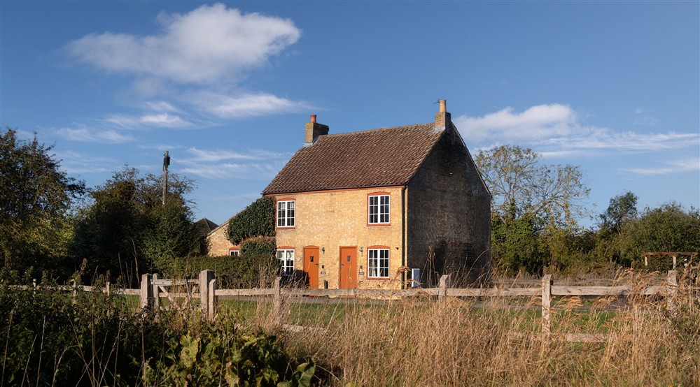 The exterior of semi-detatched holiday cottages on the edge of Wicken Fen. Cladium is on the left and Wicken Rose Cottage is on the right, Cambridgeshire at Wicken Rose Cottage in Ely, Cambridgeshire