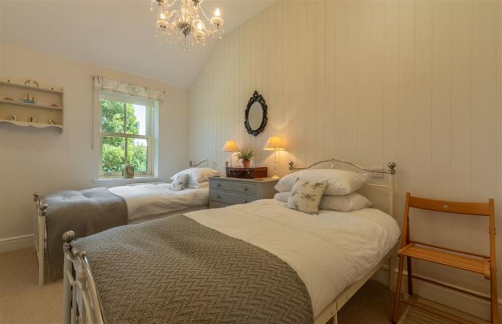 First floor: Bedroom three, full size twin single beds at Wigeon Cottage, Thornham near Hunstanton
