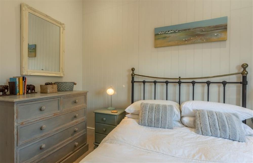 First floor: Bedroom two, double bed at Wigeon Cottage, Thornham near Hunstanton