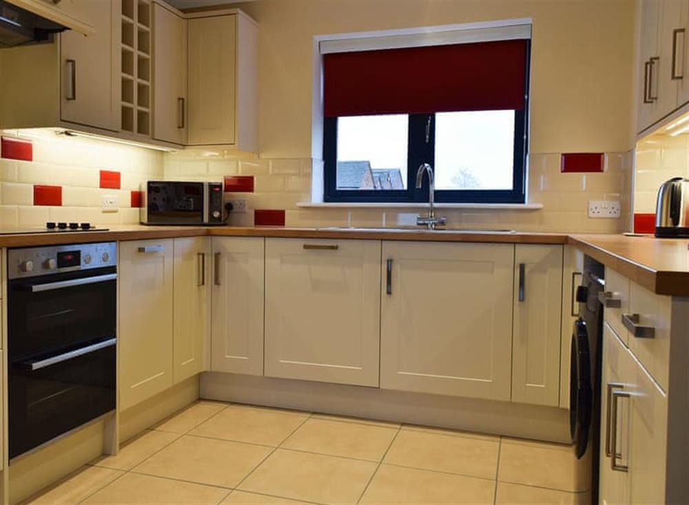 Modern fitted kitchen and dining area at Cornfield View, 