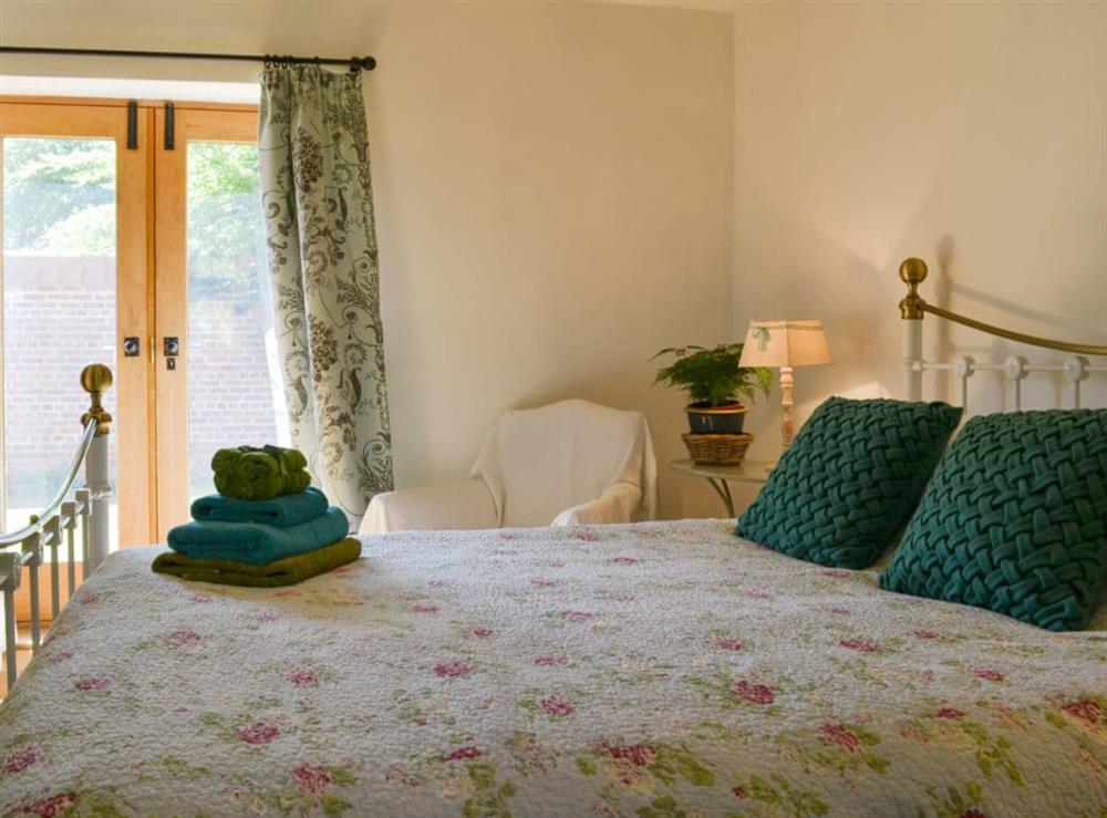 comfy bedroom at Cornflower Cottage, 