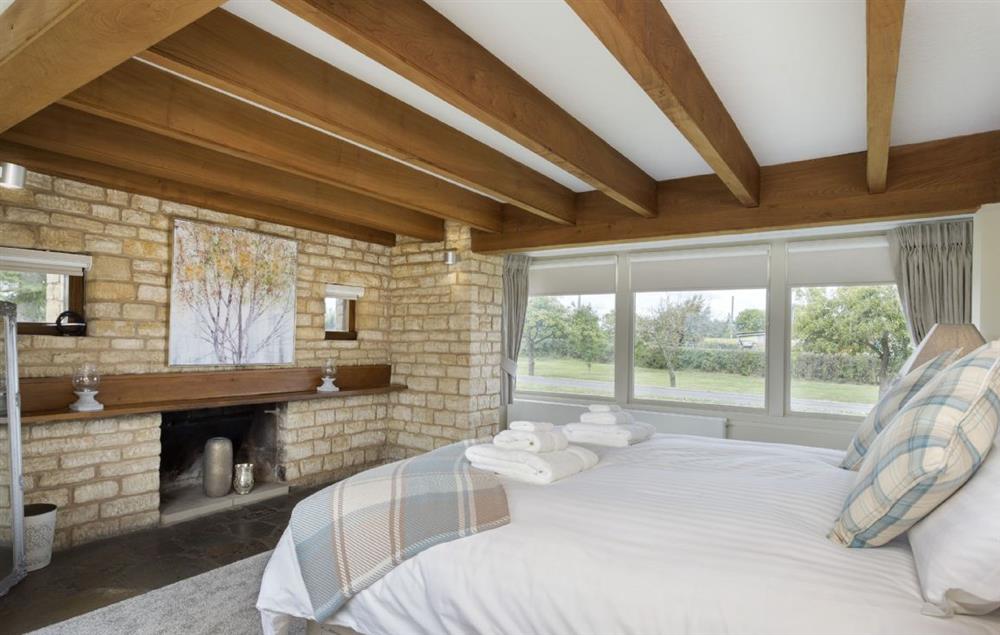 Bedroom one enjoys lovely views onto the garden at Willersey Farm House, Willersey