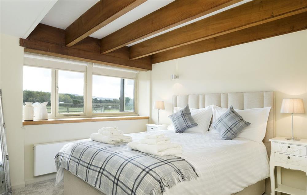 Bedroom two with a king-size bed at Willersey Farm House, Willersey