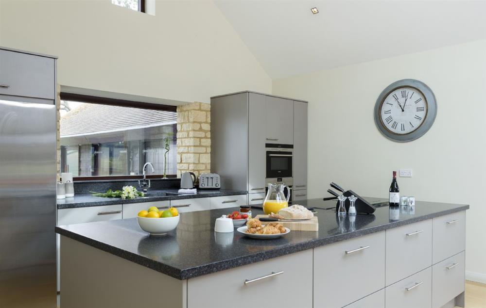 Open-plan modern and fully equipped kitchen at Willersey Farm House, Willersey