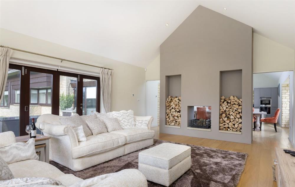 The comfortable sitting room with feature double sided fireplace