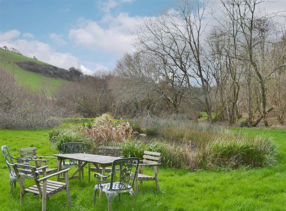 Sitting out area in the grounds (unfenced pond) at Willow Barn in Polmassick, near St Austell, Cornwall