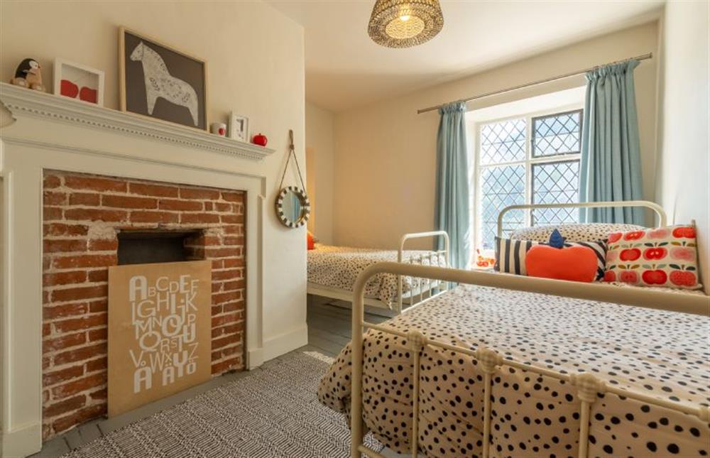 First floor: Bedroom three is a twin room at Willow Cottage, North Creake near Fakenham