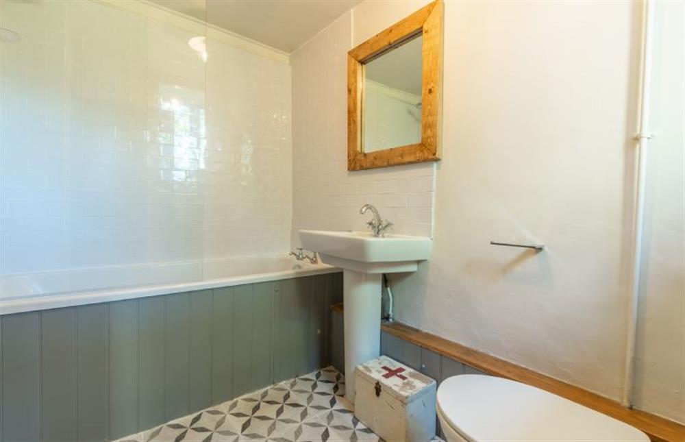 Ground floor: Bathroom has bath with shower over (photo 2) at Willow Cottage, North Creake near Fakenham