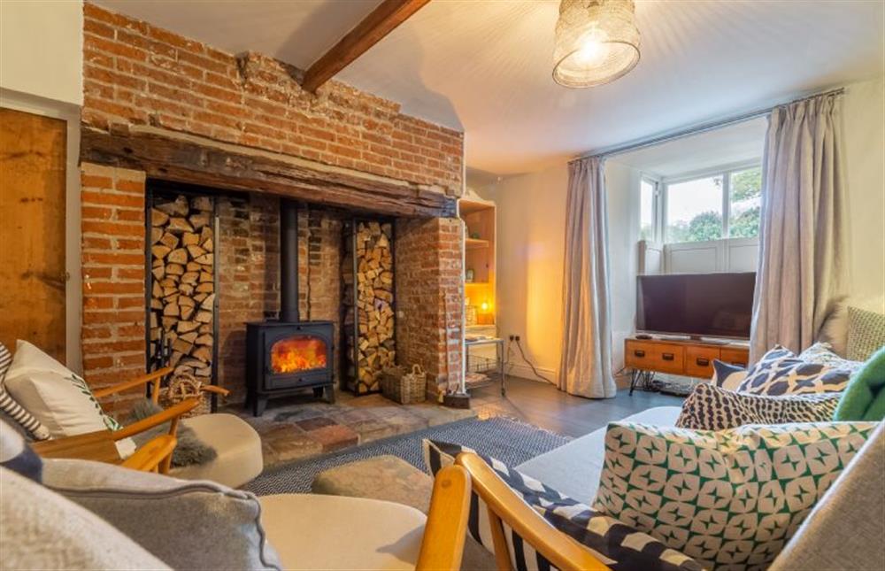 Ground floor: Large fireplace with wood burning stove at Willow Cottage, North Creake near Fakenham