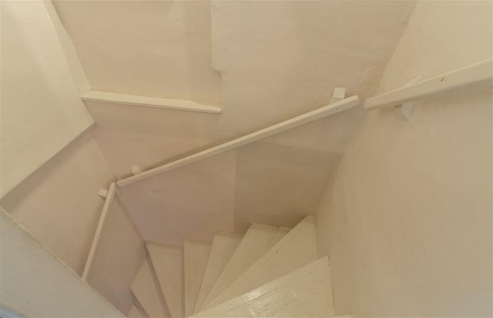 Ground floor: Steep, narrow Norfolk winder stairs at Willow Cottage, North Creake near Fakenham