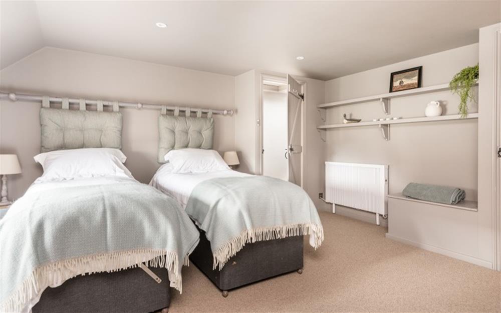 Bedroom 1 with twin beds or zip and link king size. at Willow Cottage in Northlew