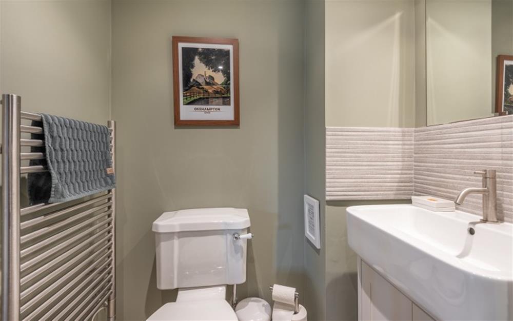 Downstairs cloakroom with w/c and wash basin. at Willow Cottage in Northlew