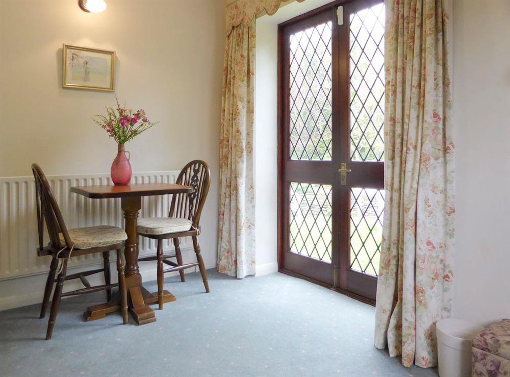 Light and airy dining area at Willow Cottage in Old Brampton, near Bakewell, Derbyshire