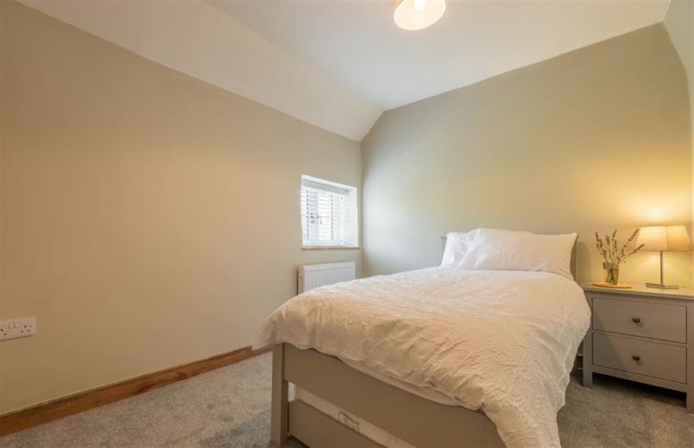 First floor: Bedroom two with single bed with trundle at Willow Cottage, South Creake near Fakenham