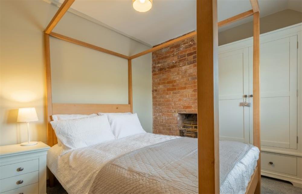 First floor: Master bedroom with double four poster bed (photo 2) at Willow Cottage, South Creake near Fakenham