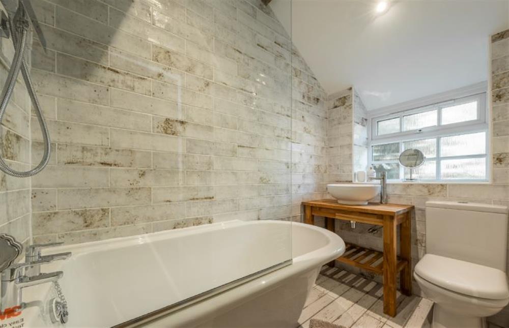 Ground floor: Bathroom with bath with shower overhead at Willow Cottage, South Creake near Fakenham