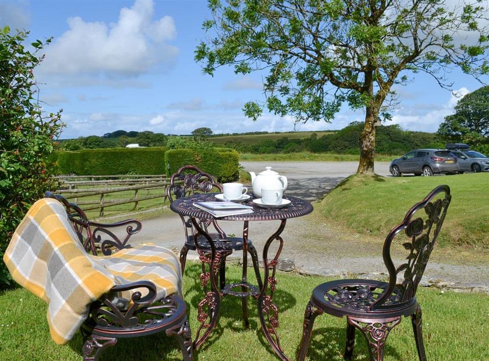 Outdoor furniture on the lawned garden area at Willow Cottage in Woolfardisworthy, near Bideford, Devon