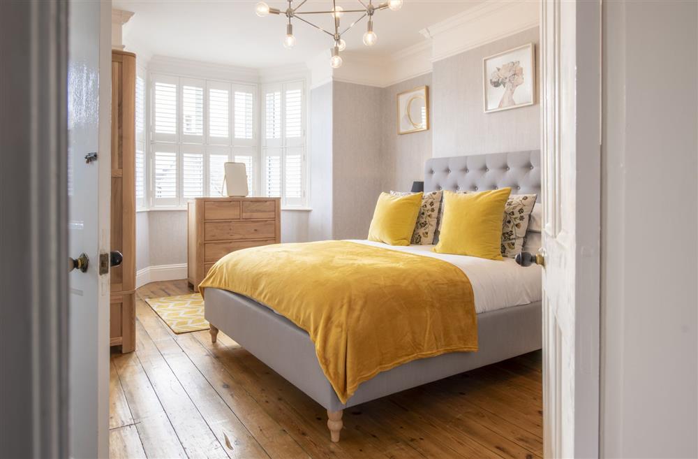 Bedroom one with a 5’ king-size bed at Willow Garth, Leyburn