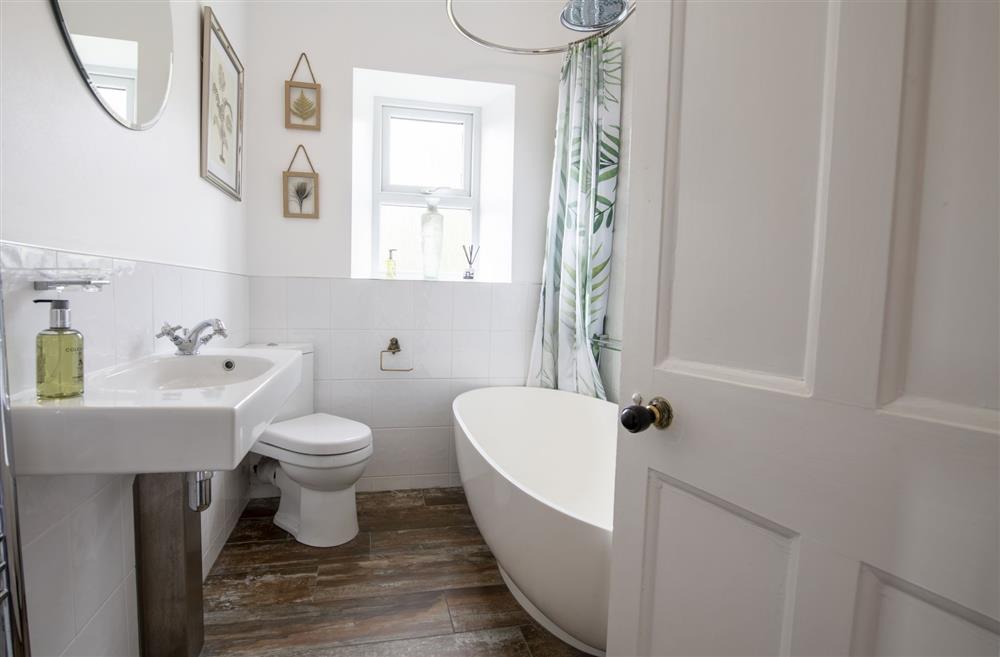 Family bathroom with a free-standing bath and overhead shower at Willow Garth, Leyburn