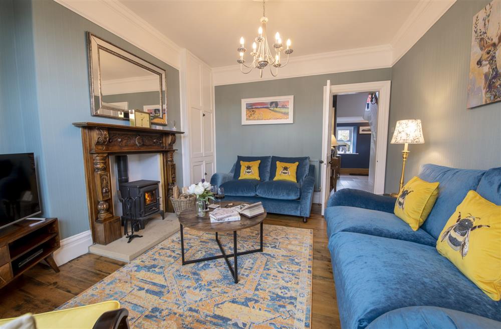 Sitting room with multi-fuel stove at Willow Garth, Leyburn