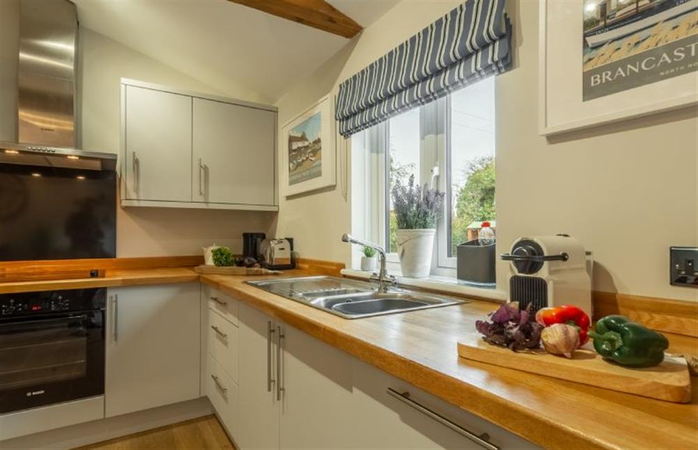 Ground floor: Bright modern kitchen at Willow Lodge, Holme-next-the-Sea near Hunstanton