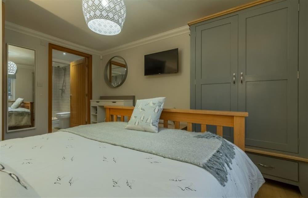 Ground floor: Master bedroom looking to the en-suite shower room at Willow Lodge, Holme-next-the-Sea near Hunstanton