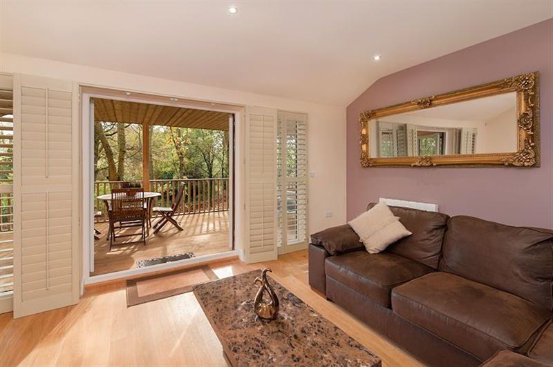 Living room and patio doors at Willow Lodge - South View Lodges, Exeter, Devon